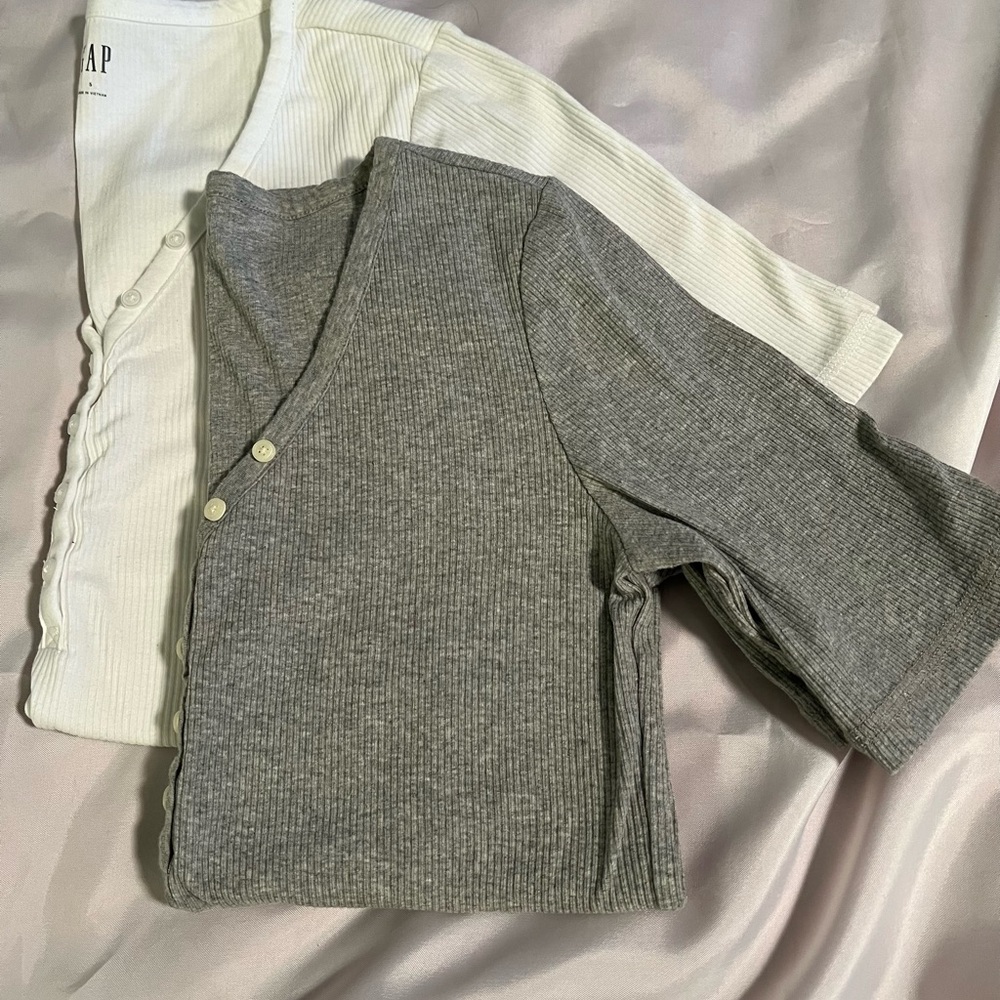 2 short sleeve Henley tops. Gray and white. 3/4 button with V neck. Never worn!